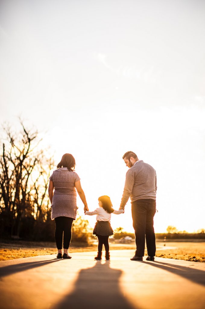 family walking together at golden hour