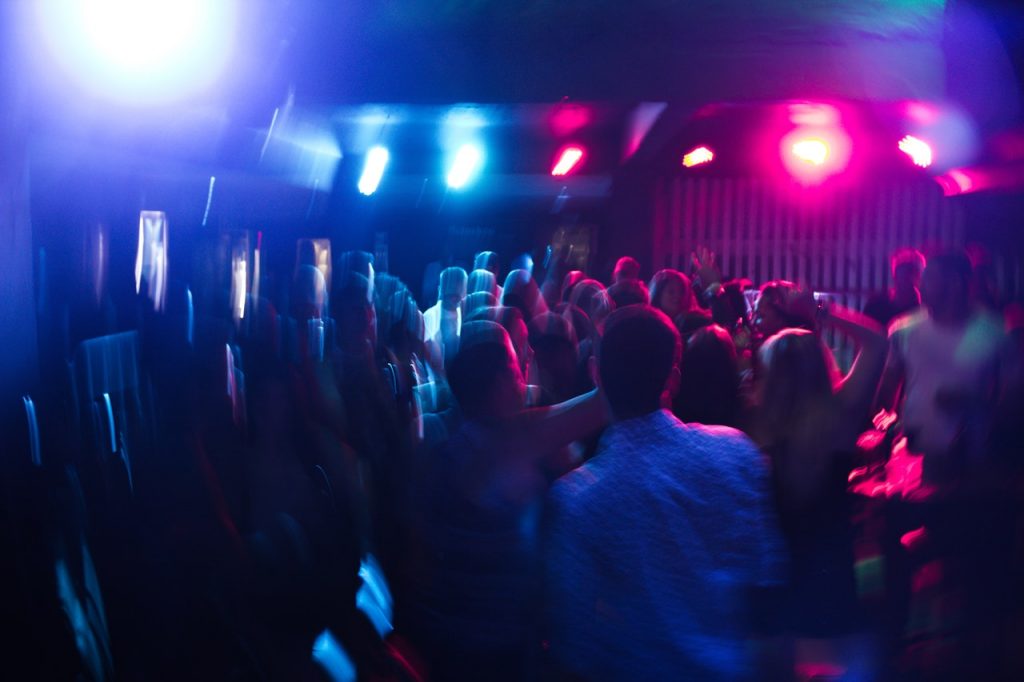 blurry photo of people dancing in a club