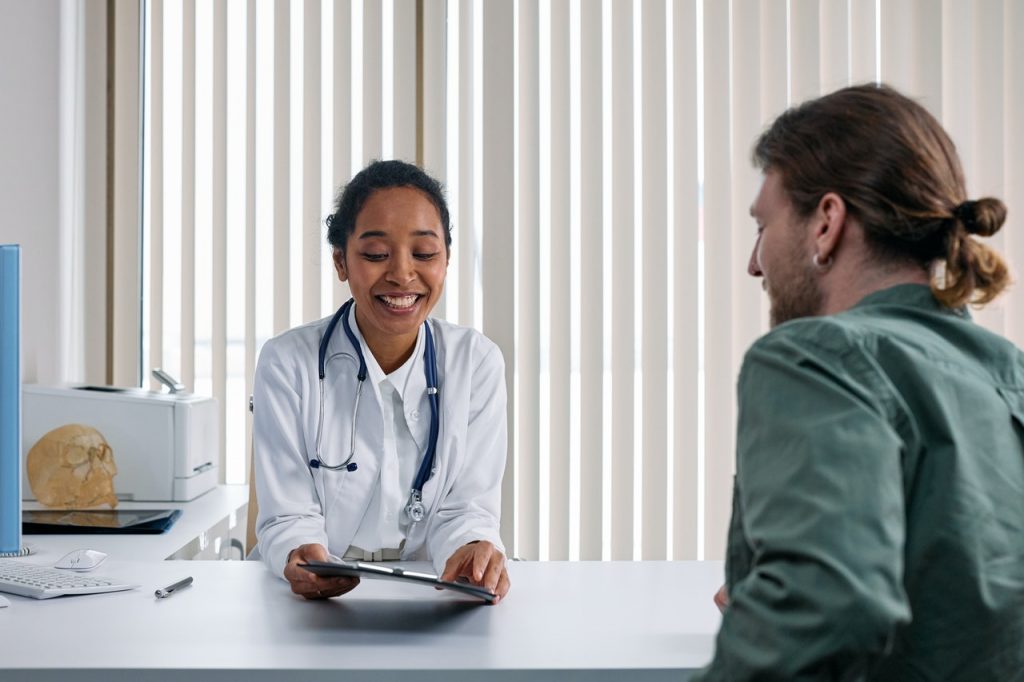 doctor talking to patient in clinic