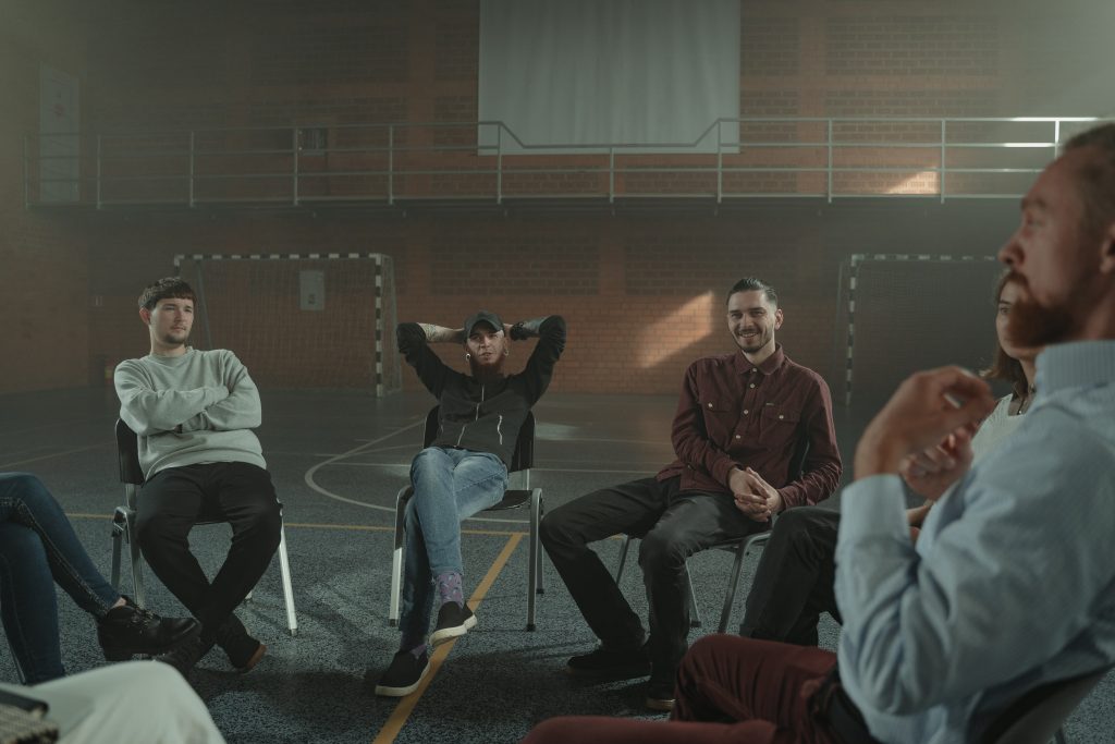 several people sitting at a support group meeting