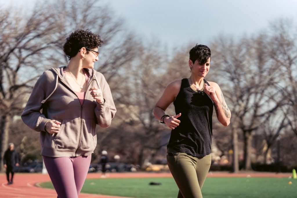 two women running together