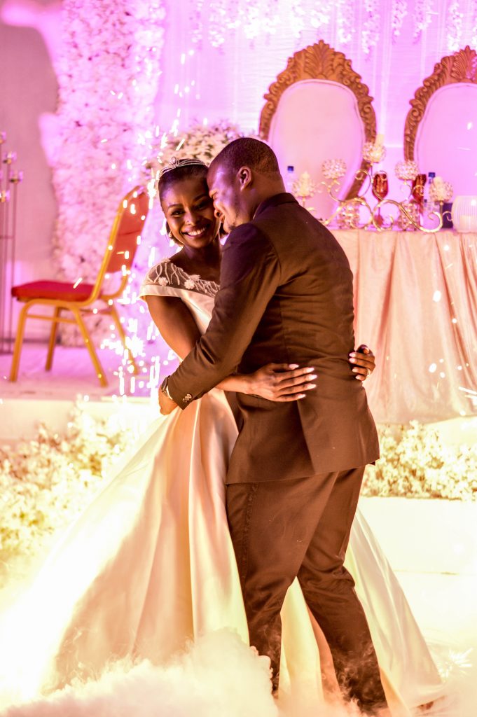 bride and groom embracing and dancing