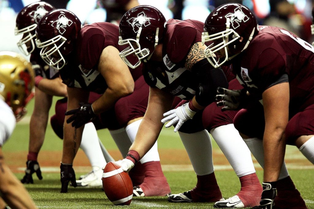 football players at scrimmage line