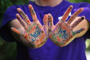 affirmative language written on a person's hands