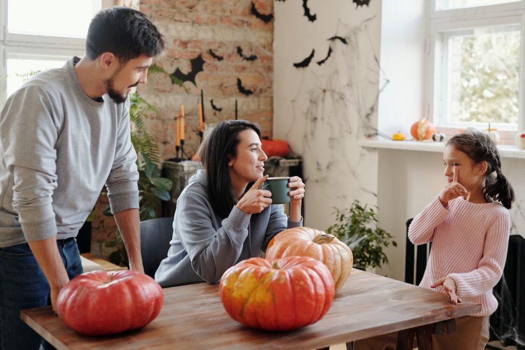 parents and child planning jack o lantern