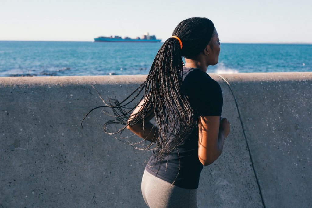 woman jogging on waterfront