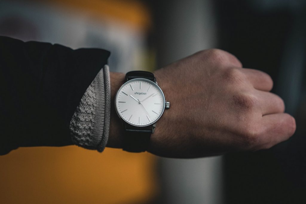 wristwatch on arm in suit