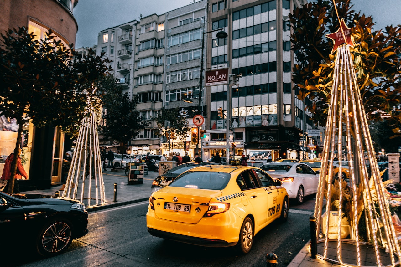 taxis and cars on busy holiday season city street