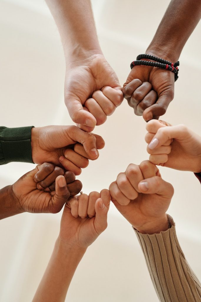 circle of hands in a support group