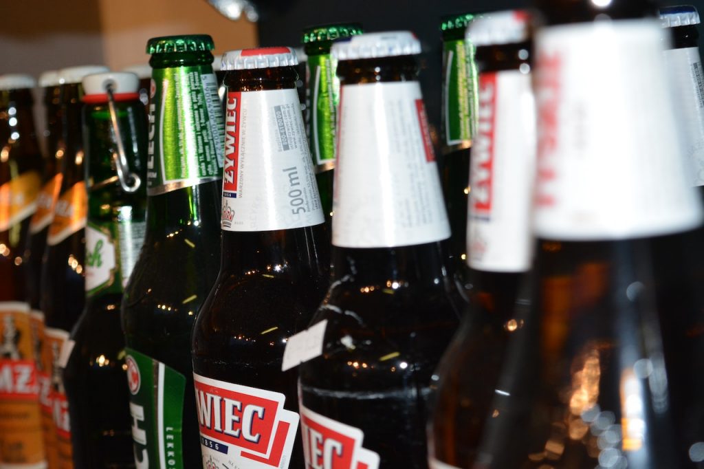 close up shot of a line of beer bottles