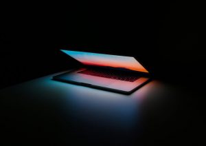 open laptop against dark background
